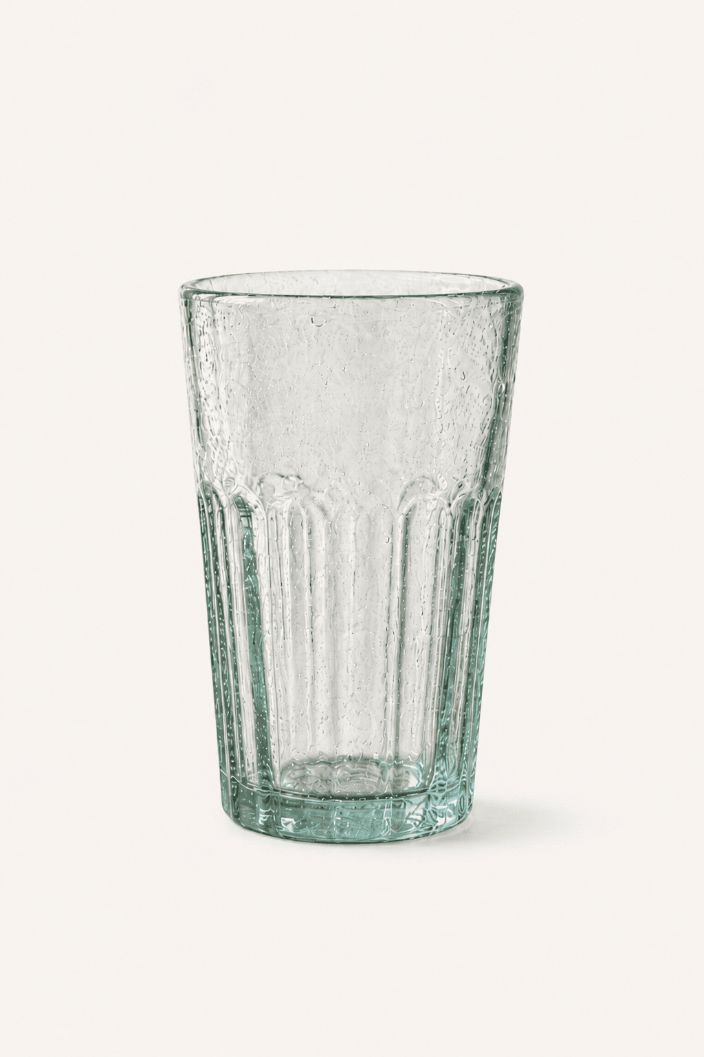 Bia Hơi glass on a warm off-white background